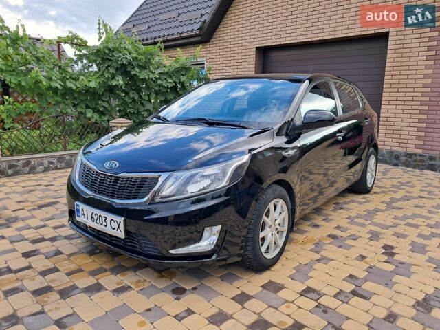 Черный Киа Рио, объемом двигателя 1.4 л и пробегом 172 тыс. км за 5700 $, фото 1 на Automoto.ua