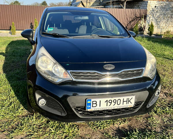 Черный Киа Рио, объемом двигателя 1.1 л и пробегом 196 тыс. км за 6500 $, фото 1 на Automoto.ua