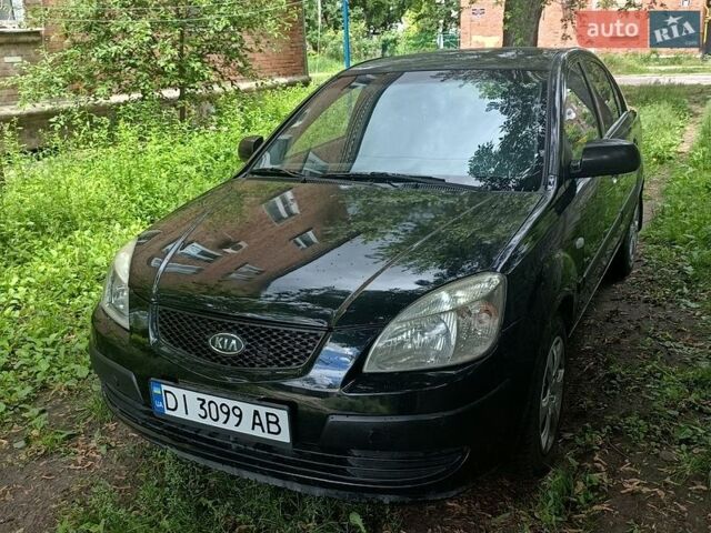 Чорний Кіа Ріо, об'ємом двигуна 1.4 л та пробігом 260 тис. км за 3900 $, фото 1 на Automoto.ua