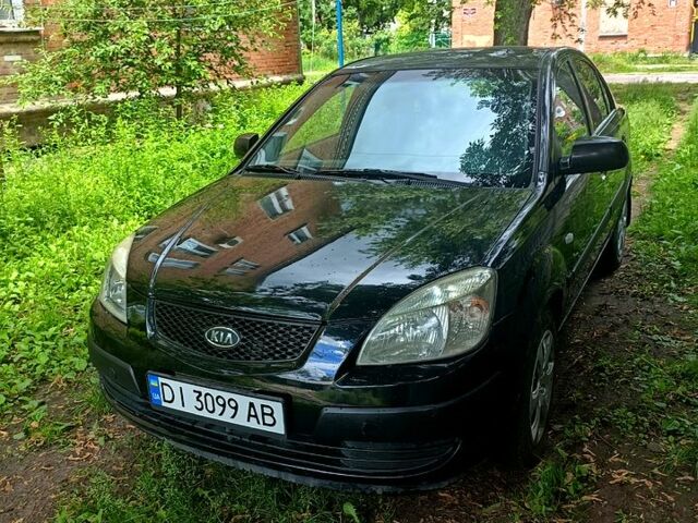 Черный Киа Рио, объемом двигателя 1.4 л и пробегом 260 тыс. км за 3900 $, фото 1 на Automoto.ua
