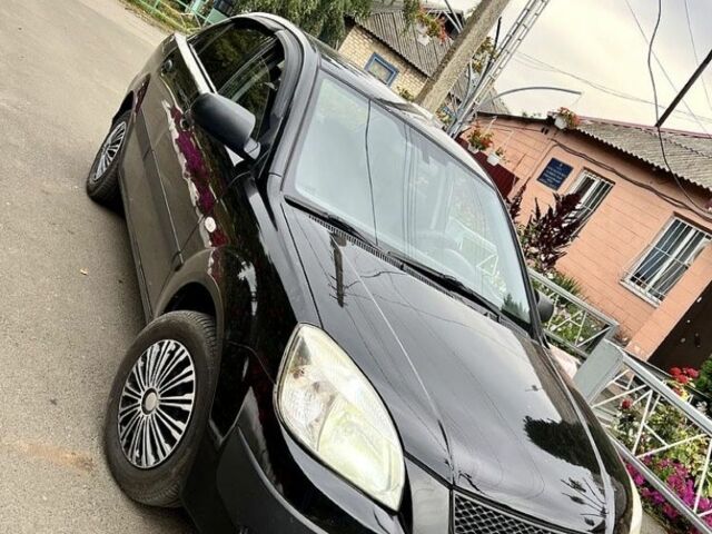 Черный Киа Рио, объемом двигателя 1.4 л и пробегом 252 тыс. км за 3889 $, фото 1 на Automoto.ua