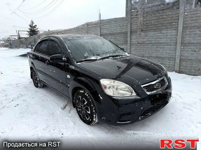 Чорний Кіа Ріо, об'ємом двигуна 1.4 л та пробігом 167 тис. км за 5550 $, фото 1 на Automoto.ua