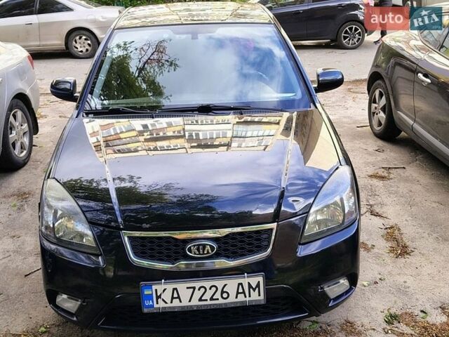 Черный Киа Рио, объемом двигателя 1.4 л и пробегом 325 тыс. км за 5250 $, фото 1 на Automoto.ua