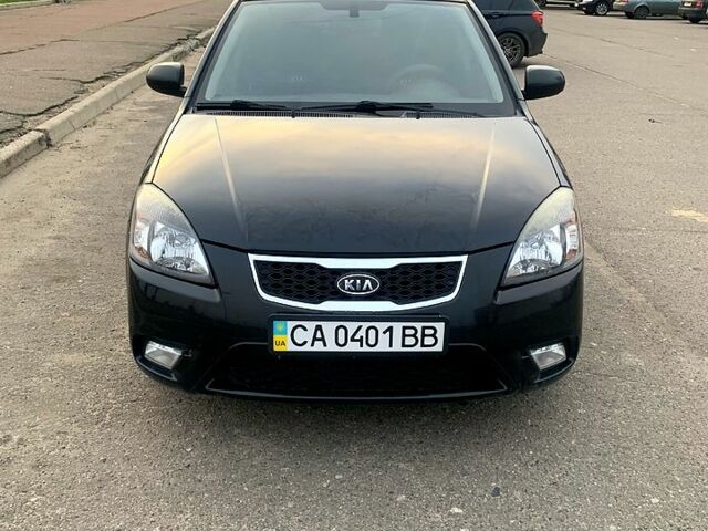 Черный Киа Рио, объемом двигателя 1.4 л и пробегом 189 тыс. км за 5463 $, фото 1 на Automoto.ua