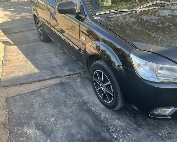 Черный Киа Рио, объемом двигателя 1.4 л и пробегом 282 тыс. км за 4700 $, фото 1 на Automoto.ua