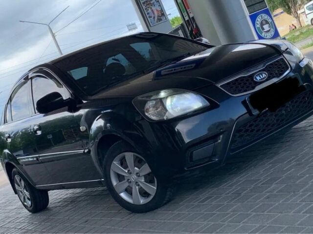 Чорний Кіа Ріо, об'ємом двигуна 1.4 л та пробігом 204 тис. км за 4600 $, фото 1 на Automoto.ua