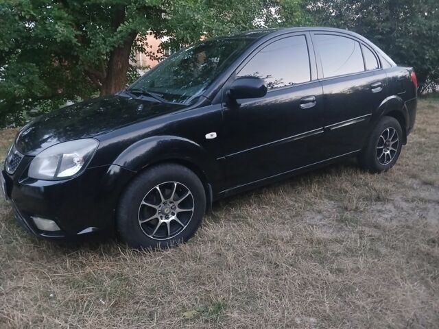 Чорний Кіа Ріо, об'ємом двигуна 1.4 л та пробігом 210 тис. км за 4308 $, фото 1 на Automoto.ua
