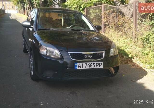 Чорний Кіа Ріо, об'ємом двигуна 1.4 л та пробігом 248 тис. км за 4650 $, фото 1 на Automoto.ua