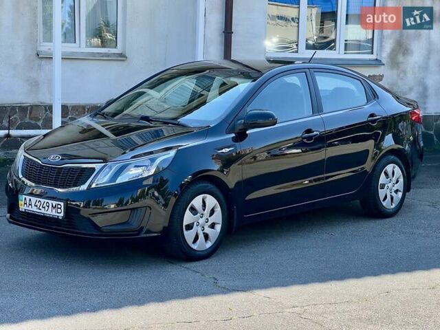 Чорний Кіа Ріо, об'ємом двигуна 1.4 л та пробігом 126 тис. км за 7900 $, фото 1 на Automoto.ua