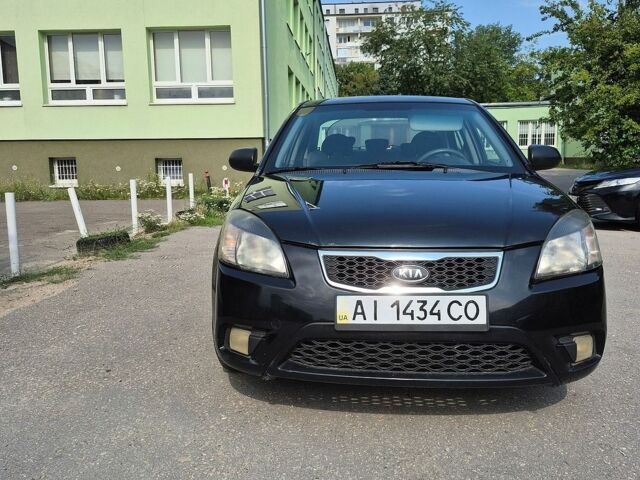 Чорний Кіа Ріо, об'ємом двигуна 1.4 л та пробігом 244 тис. км за 4700 $, фото 1 на Automoto.ua