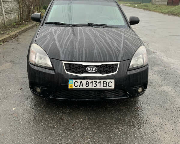 Черный Киа Рио, объемом двигателя 1.4 л и пробегом 105 тыс. км за 4100 $, фото 1 на Automoto.ua