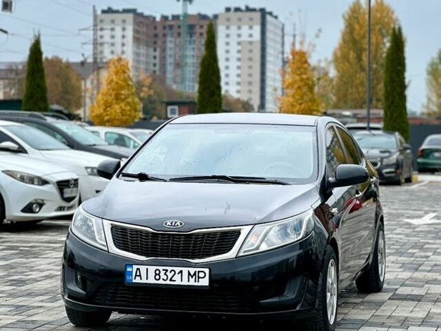 Черный Киа Рио, объемом двигателя 1.4 л и пробегом 180 тыс. км за 5900 $, фото 1 на Automoto.ua