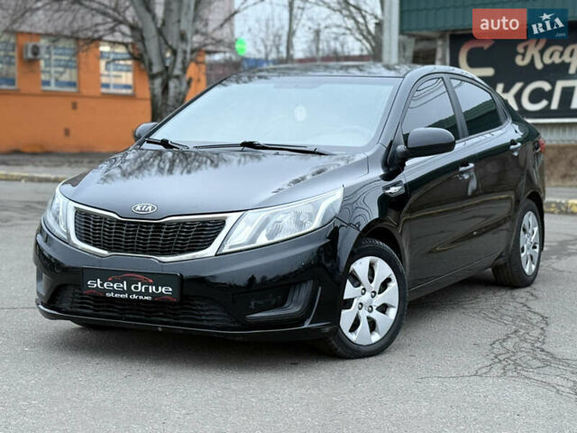 Черный Киа Рио, объемом двигателя 1.4 л и пробегом 193 тыс. км за 6599 $, фото 1 на Automoto.ua