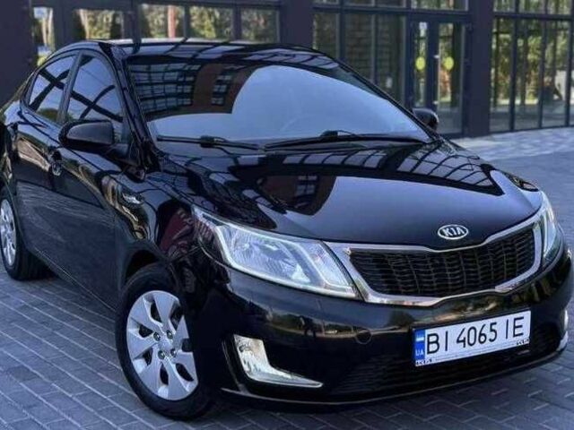 Черный Киа Рио, объемом двигателя 1.4 л и пробегом 100 тыс. км за 7607 $, фото 1 на Automoto.ua