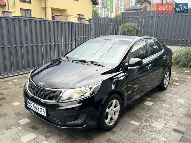 Чорний Кіа Ріо, об'ємом двигуна 1.4 л та пробігом 199 тис. км за 5999 $, фото 1 на Automoto.ua