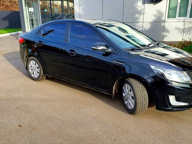 Черный Киа Рио, объемом двигателя 1.6 л и пробегом 246 тыс. км за 6600 $, фото 1 на Automoto.ua