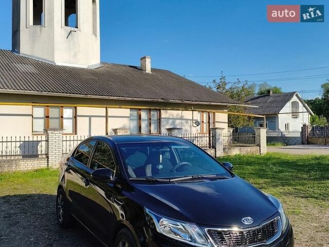 Чорний Кіа Ріо, об'ємом двигуна 1.4 л та пробігом 120 тис. км за 6900 $, фото 1 на Automoto.ua