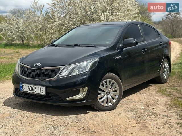 Чорний Кіа Ріо, об'ємом двигуна 1.4 л та пробігом 108 тис. км за 7950 $, фото 1 на Automoto.ua
