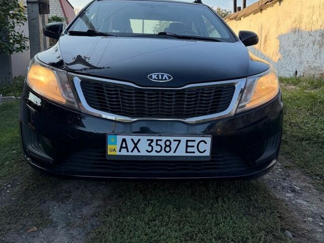 Чорний Кіа Ріо, об'ємом двигуна 1.4 л та пробігом 73 тис. км за 8900 $, фото 1 на Automoto.ua