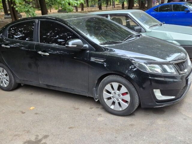 Черный Киа Рио, объемом двигателя 1.59 л и пробегом 127 тыс. км за 8800 $, фото 1 на Automoto.ua