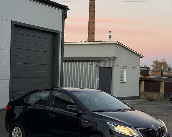 Чорний Кіа Ріо, об'ємом двигуна 1.4 л та пробігом 136 тис. км за 6900 $, фото 1 на Automoto.ua