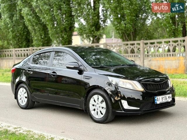 Черный Киа Рио, объемом двигателя 1.59 л и пробегом 132 тыс. км за 8999 $, фото 1 на Automoto.ua