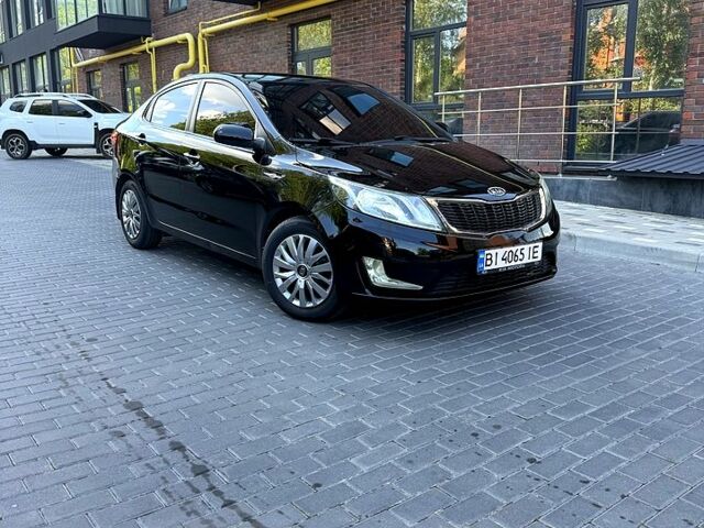 Чорний Кіа Ріо, об'ємом двигуна 1.4 л та пробігом 103 тис. км за 7800 $, фото 1 на Automoto.ua