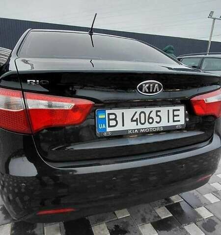 Чорний Кіа Ріо, об'ємом двигуна 1.4 л та пробігом 100 тис. км за 7607 $, фото 1 на Automoto.ua