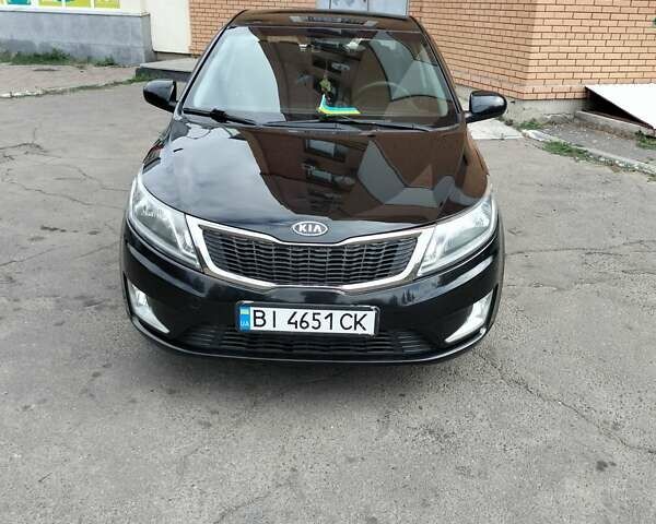 Чорний Кіа Ріо, об'ємом двигуна 1.4 л та пробігом 123 тис. км за 7600 $, фото 1 на Automoto.ua