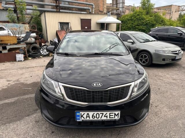 Чорний Кіа Ріо, об'ємом двигуна 1.4 л та пробігом 230 тис. км за 5500 $, фото 1 на Automoto.ua