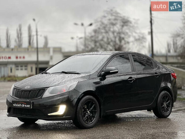 Черный Киа Рио, объемом двигателя 1.6 л и пробегом 231 тыс. км за 7999 $, фото 1 на Automoto.ua