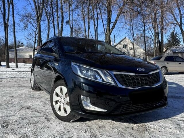 Чорний Кіа Ріо, об'ємом двигуна 1.4 л та пробігом 160 тис. км за 7700 $, фото 1 на Automoto.ua