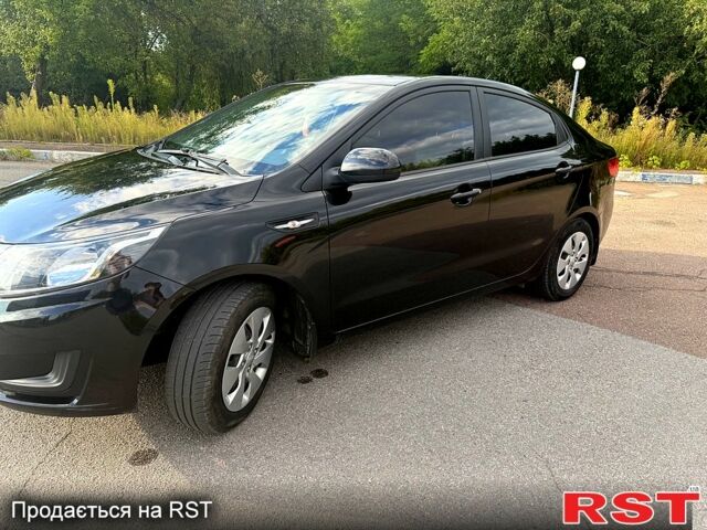 Черный Киа Рио, объемом двигателя 1.4 л и пробегом 74 тыс. км за 9100 $, фото 1 на Automoto.ua