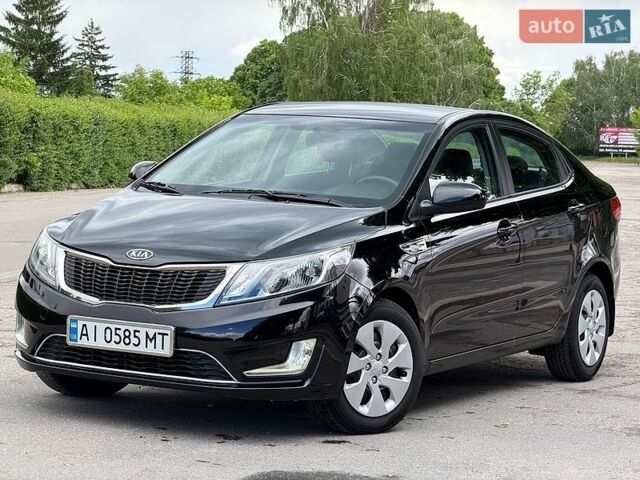 Чорний Кіа Ріо, об'ємом двигуна 1.4 л та пробігом 76 тис. км за 8850 $, фото 1 на Automoto.ua