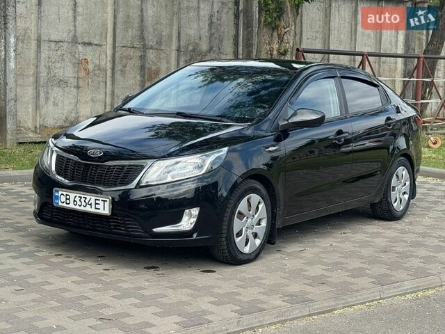 Чорний Кіа Ріо, об'ємом двигуна 1.4 л та пробігом 155 тис. км за 7500 $, фото 1 на Automoto.ua