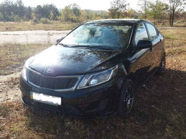Чорний Кіа Ріо, об'ємом двигуна 1.4 л та пробігом 77 тис. км за 9200 $, фото 1 на Automoto.ua