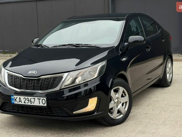 Чорний Кіа Ріо, об'ємом двигуна 1.4 л та пробігом 202 тис. км за 6900 $, фото 1 на Automoto.ua