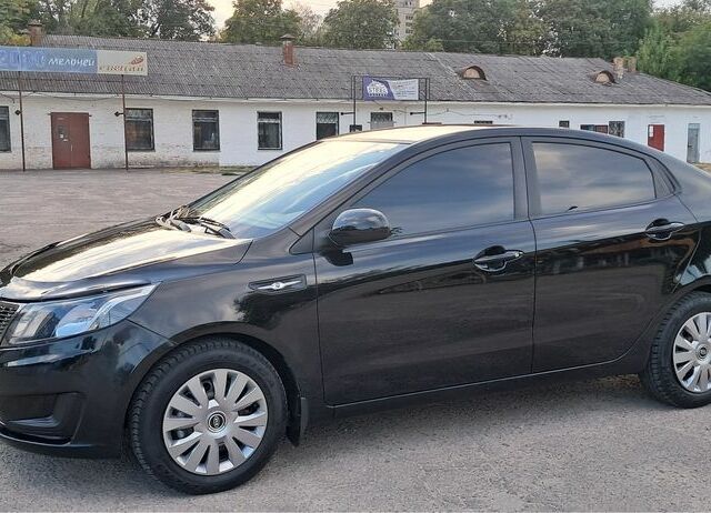 Чорний Кіа Ріо, об'ємом двигуна 1.4 л та пробігом 89 тис. км за 6800 $, фото 1 на Automoto.ua