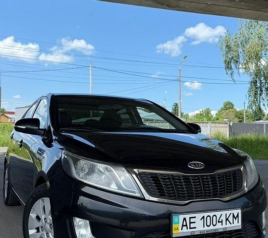 Черный Киа Рио, объемом двигателя 1.59 л и пробегом 204 тыс. км за 7000 $, фото 1 на Automoto.ua