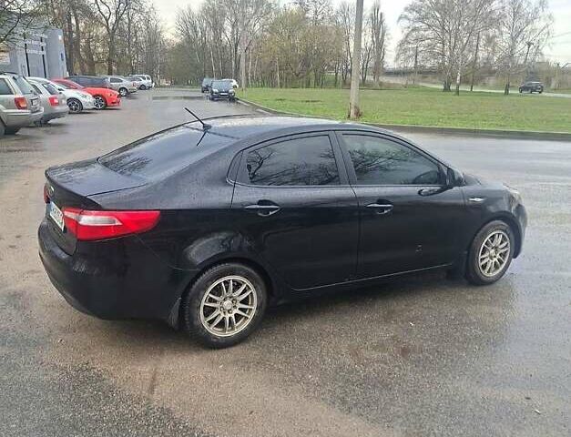 Черный Киа Рио, объемом двигателя 1.4 л и пробегом 197 тыс. км за 7000 $, фото 1 на Automoto.ua