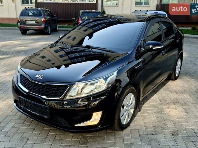 Черный Киа Рио, объемом двигателя 1.6 л и пробегом 130 тыс. км за 8750 $, фото 1 на Automoto.ua