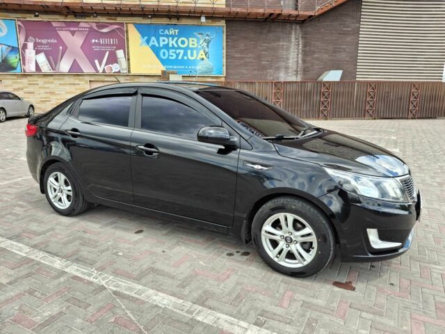 Чорний Кіа Ріо, об'ємом двигуна 1.4 л та пробігом 96 тис. км за 8000 $, фото 1 на Automoto.ua