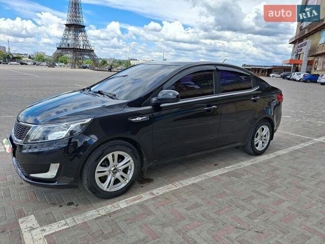 Черный Киа Рио, объемом двигателя 1.4 л и пробегом 96 тыс. км за 9200 $, фото 1 на Automoto.ua