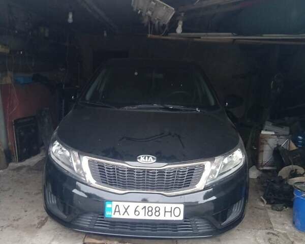 Черный Киа Рио, объемом двигателя 1.4 л и пробегом 84 тыс. км за 8700 $, фото 1 на Automoto.ua