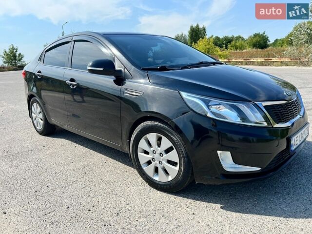 Чорний Кіа Ріо, об'ємом двигуна 1.6 л та пробігом 142 тис. км за 6800 $, фото 1 на Automoto.ua