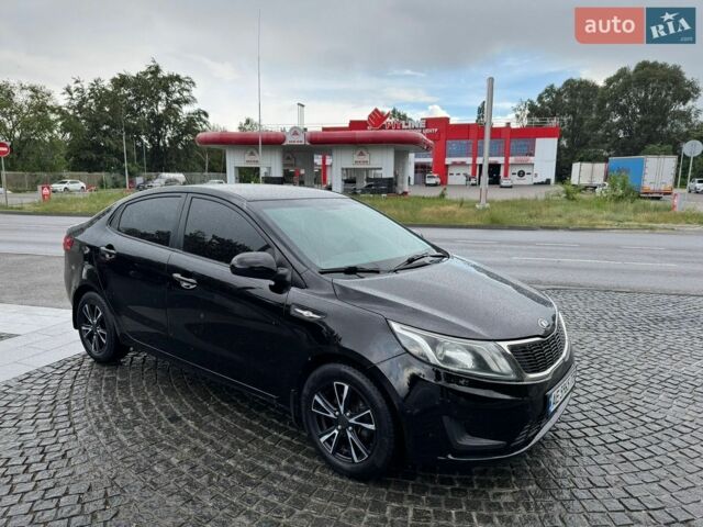 Чорний Кіа Ріо, об'ємом двигуна 1.4 л та пробігом 107 тис. км за 7500 $, фото 1 на Automoto.ua