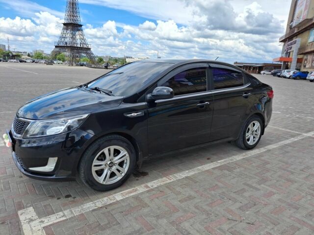 Черный Киа Рио, объемом двигателя 1.4 л и пробегом 96 тыс. км за 9200 $, фото 1 на Automoto.ua