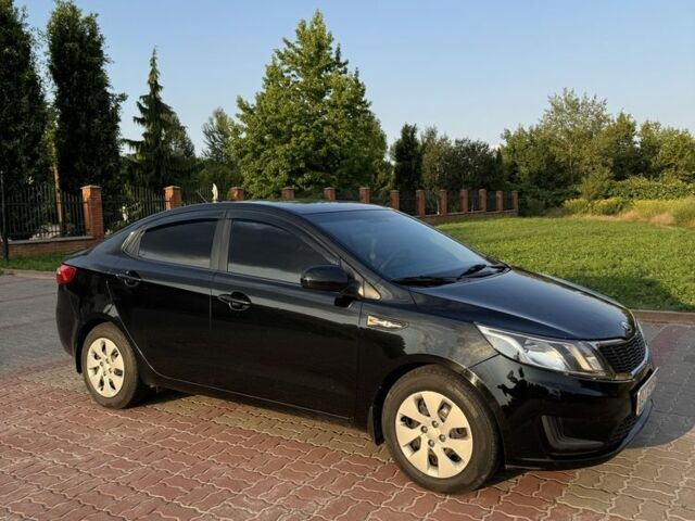 Черный Киа Рио, объемом двигателя 1.4 л и пробегом 185 тыс. км за 5777 $, фото 1 на Automoto.ua