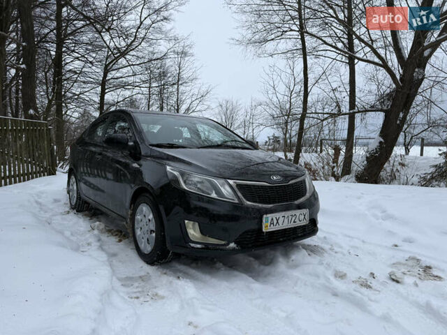 Чорний Кіа Ріо, об'ємом двигуна 1.4 л та пробігом 123 тис. км за 7300 $, фото 1 на Automoto.ua
