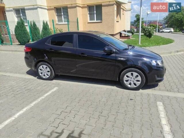 Чорний Кіа Ріо, об'ємом двигуна 1.4 л та пробігом 186 тис. км за 6800 $, фото 1 на Automoto.ua